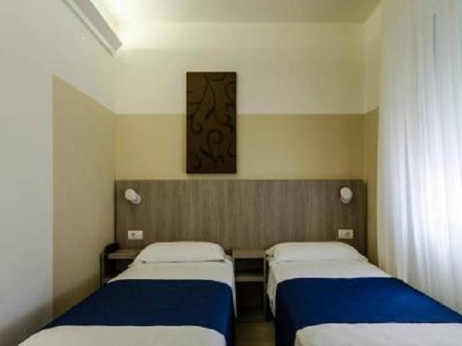 Postel nebo postele na pokoji v ubytování Hotel Mare Live