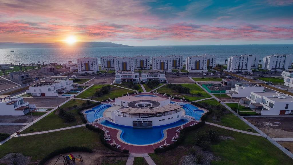 an aerial view of a city with the ocean at Casa en Nuevo Paracas in Paracas