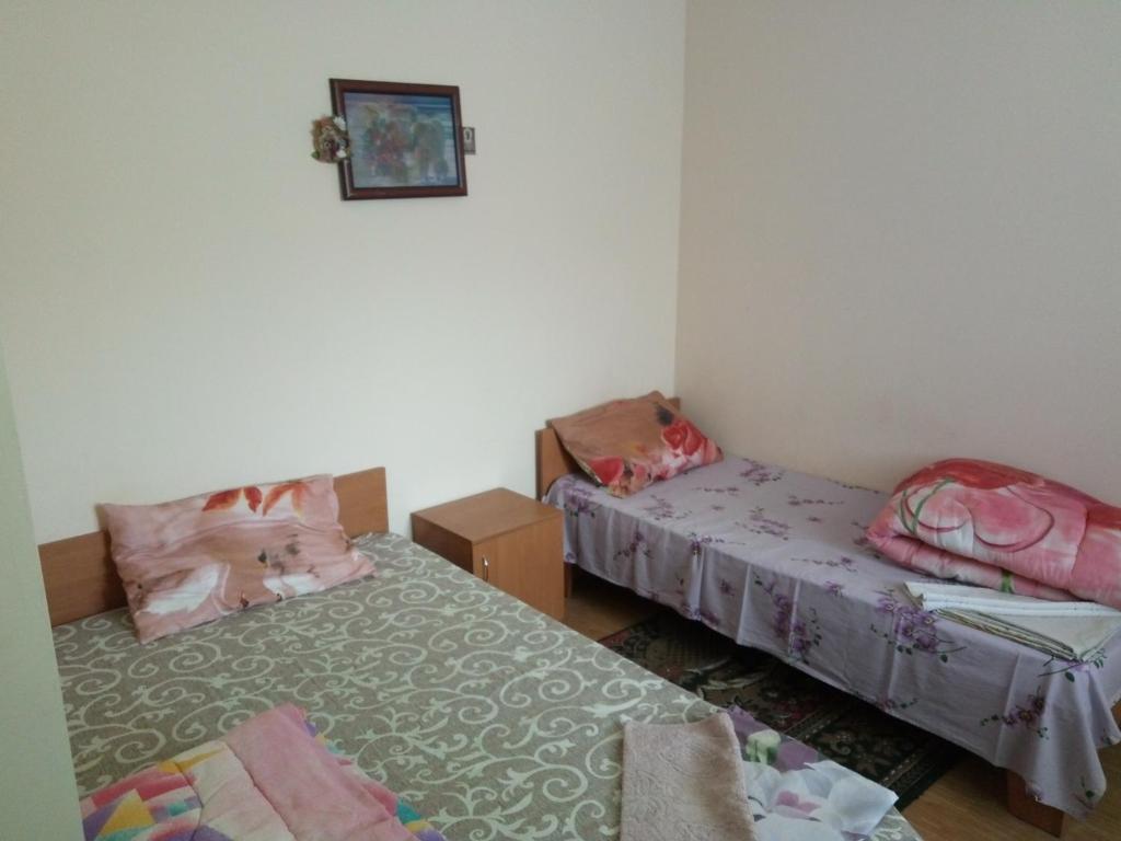 Postel nebo postele na pokoji v ubytování Hotel Uyut