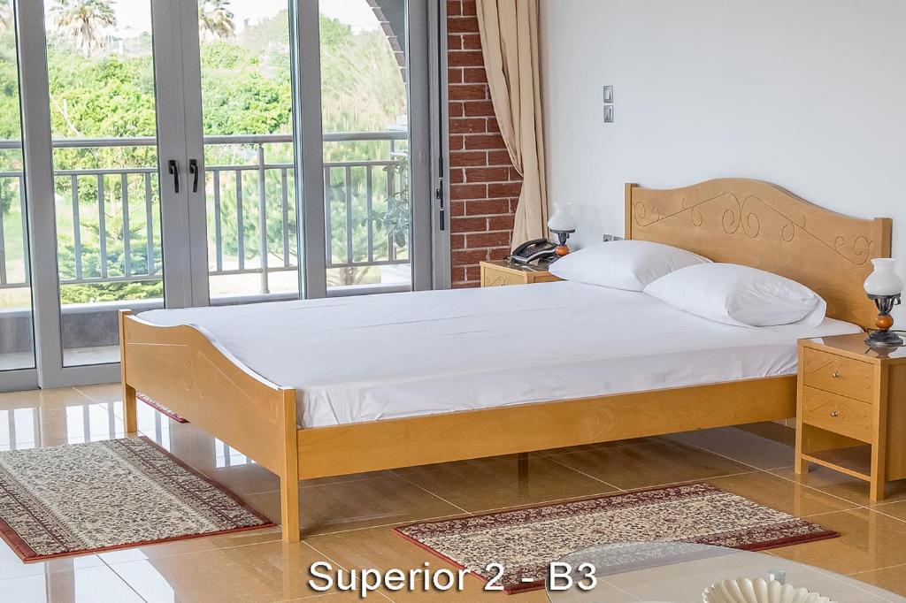 Postel nebo postele na pokoji v ubytování Ionion Star Hotel