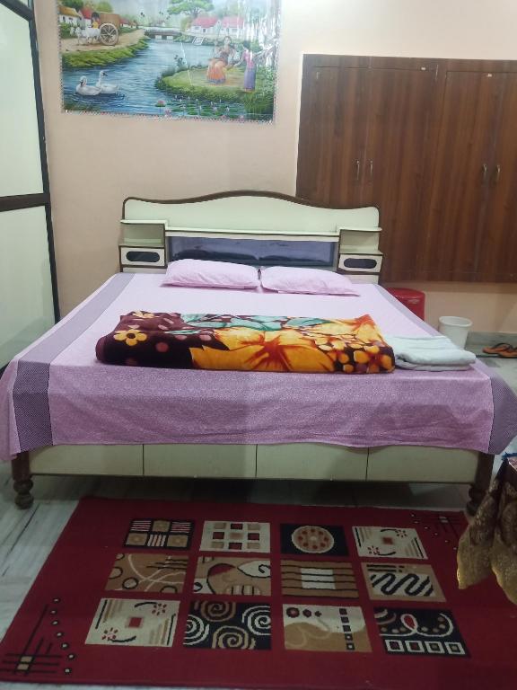 Postel nebo postele na pokoji v ubytování Sunita homestay