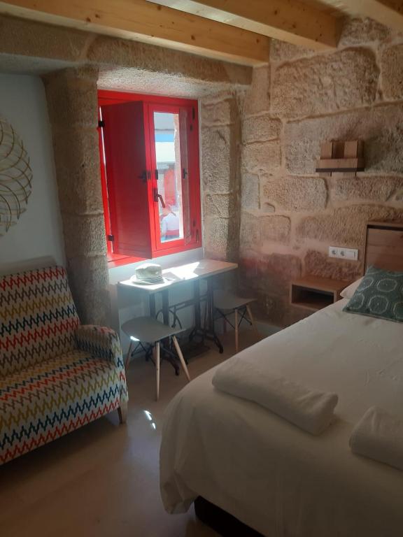 Postel nebo postele na pokoji v ubytování Casa Choupas