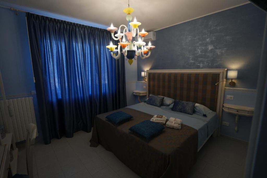 Postel nebo postele na pokoji v ubytování B&B Sogno D'Estate