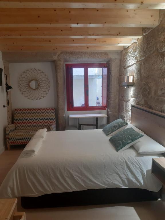Postel nebo postele na pokoji v ubytování Casa Choupas