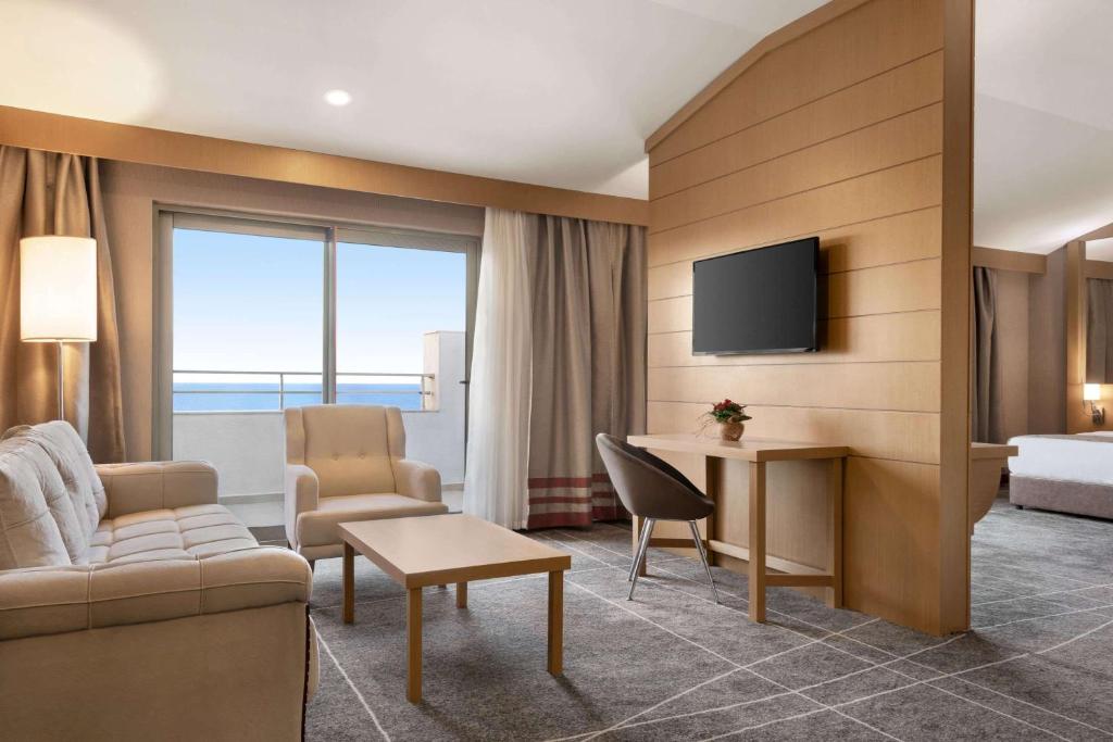 A television and/or entertainment centre at Ramada Resort by Wyndham Unye