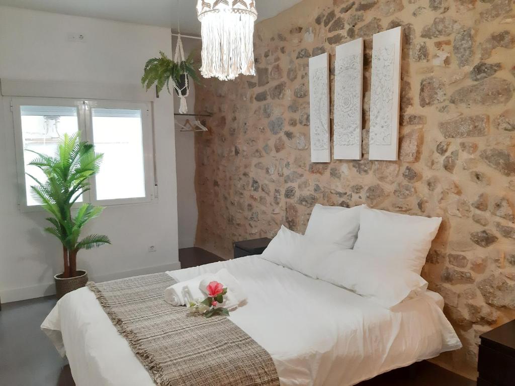 Postel nebo postele na pokoji v ubytování Ananda Beach Rooms