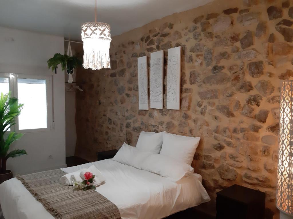 Postel nebo postele na pokoji v ubytování Ananda Beach Rooms