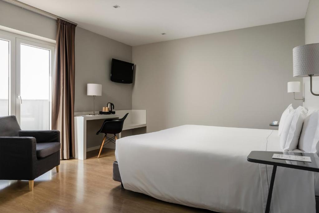 Cama ou camas em um quarto em ClipHotel