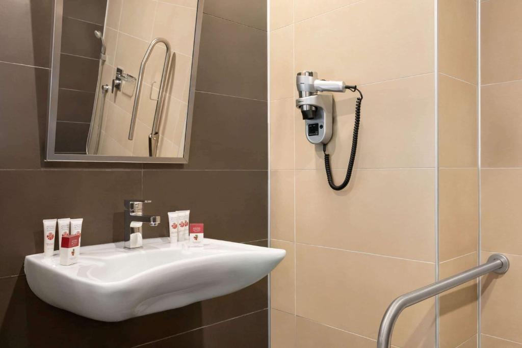 A bathroom at Ramada Resort by Wyndham Unye