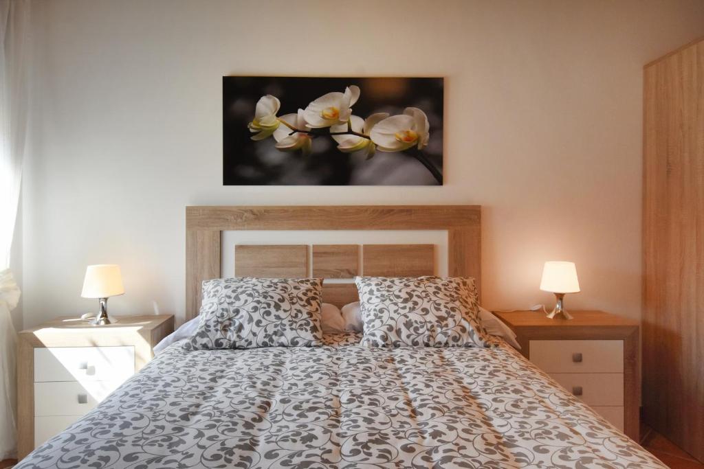 A bed or beds in a room at Las Casas de Pecheye