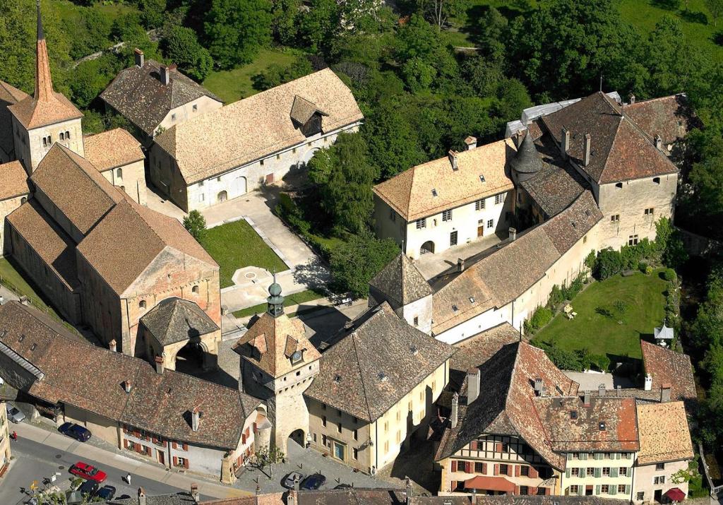 an aerial view of a group of buildings at Maison Junod in Romainmôtier