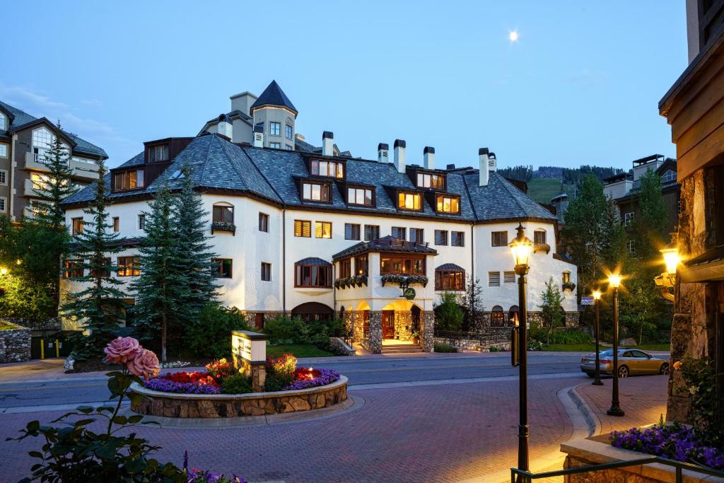 a large white building on a city street at Poste Montane Lodge by East West in Beaver Creek