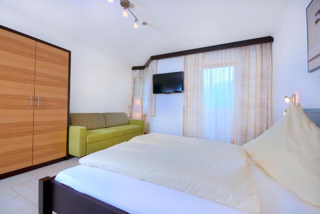 Postel nebo postele na pokoji v ubytování Panoramahotel Burgeck