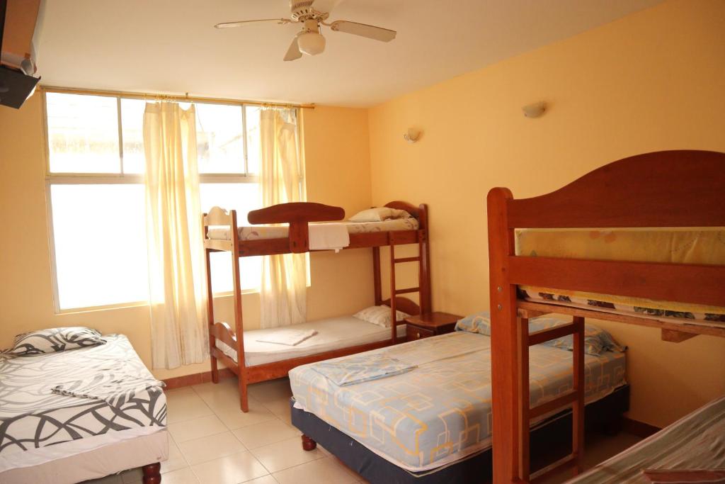 Postel nebo postele na pokoji v ubytování Hotel Atacames Inn