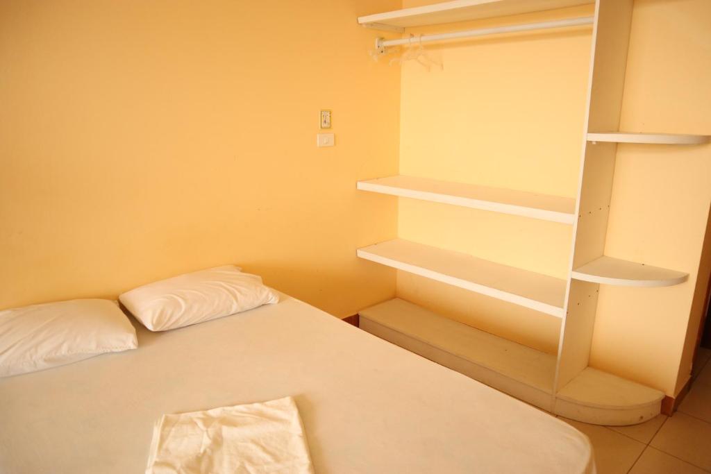 Postel nebo postele na pokoji v ubytování Hotel Atacames Inn