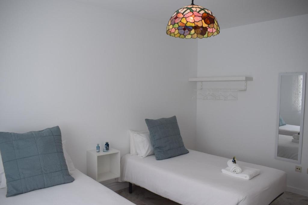 Postel nebo postele na pokoji v ubytování La Casa de Manuel