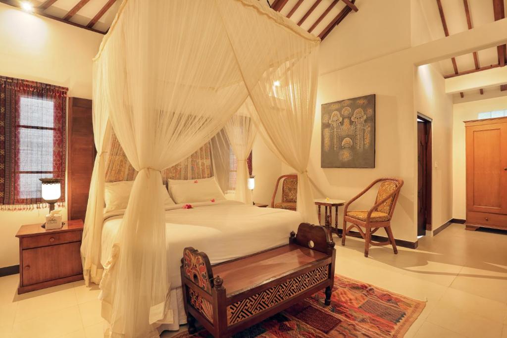 Voodi või voodid majutusasutuse Puri Mas Boutique Resort & Spa toas