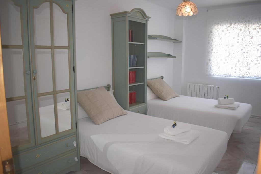 Postel nebo postele na pokoji v ubytování La Casa de Manuel