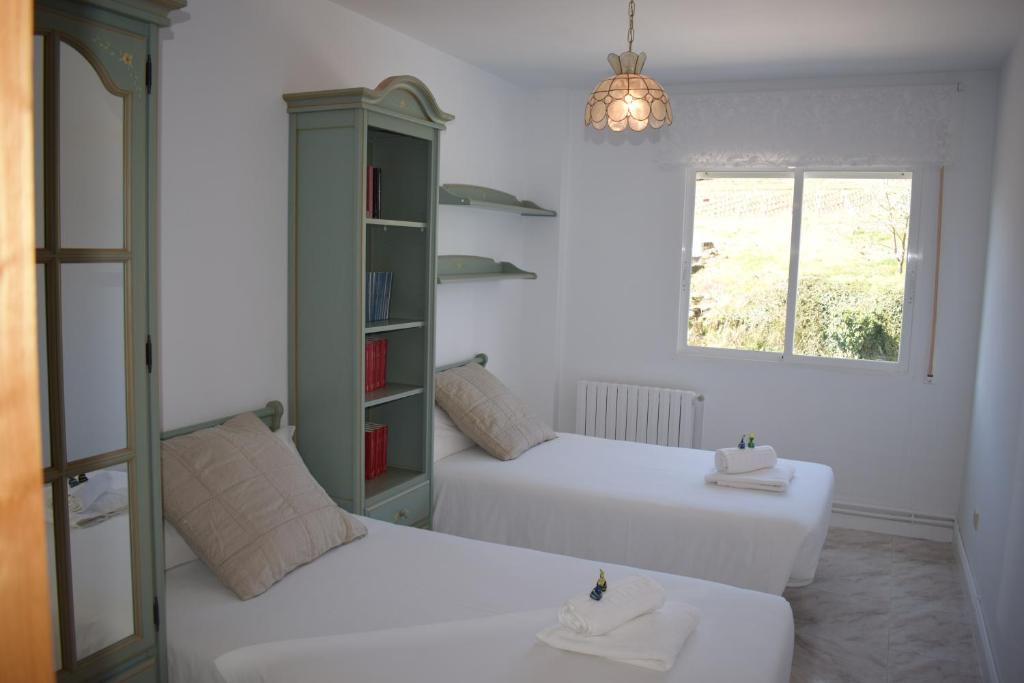 Postel nebo postele na pokoji v ubytování La Casa de Manuel