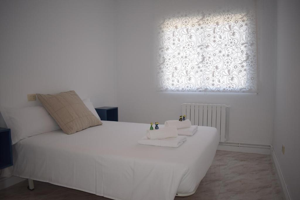 Postel nebo postele na pokoji v ubytování La Casa de Manuel