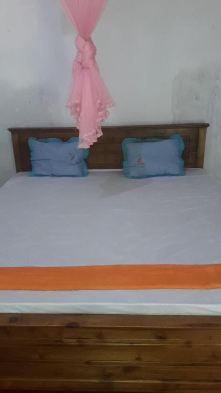 Postel nebo postele na pokoji v ubytování Colonial Surfing Villa Hostel & Home Stay