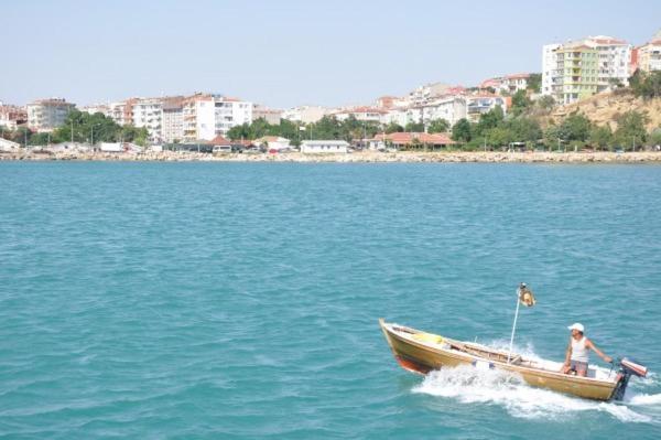 a person in a boat on a body of water at Silivri Park Hotel in Silivri