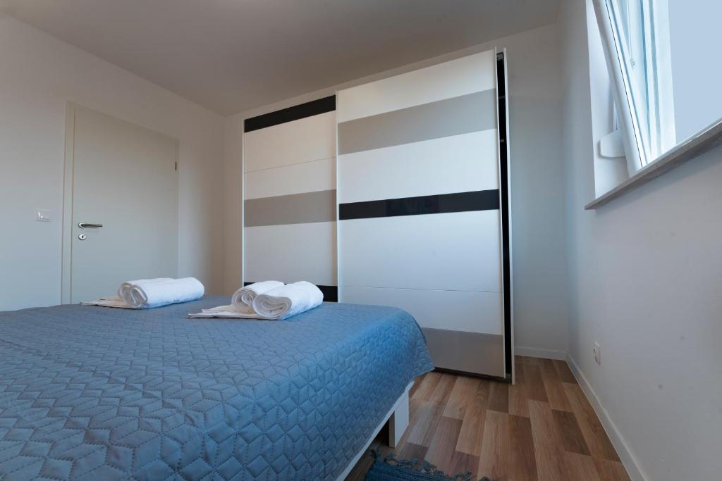 Posteľ alebo postele v izbe v ubytovaní Apartment AleMar