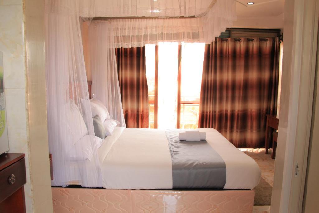 Postel nebo postele na pokoji v ubytování Interservice Hotel