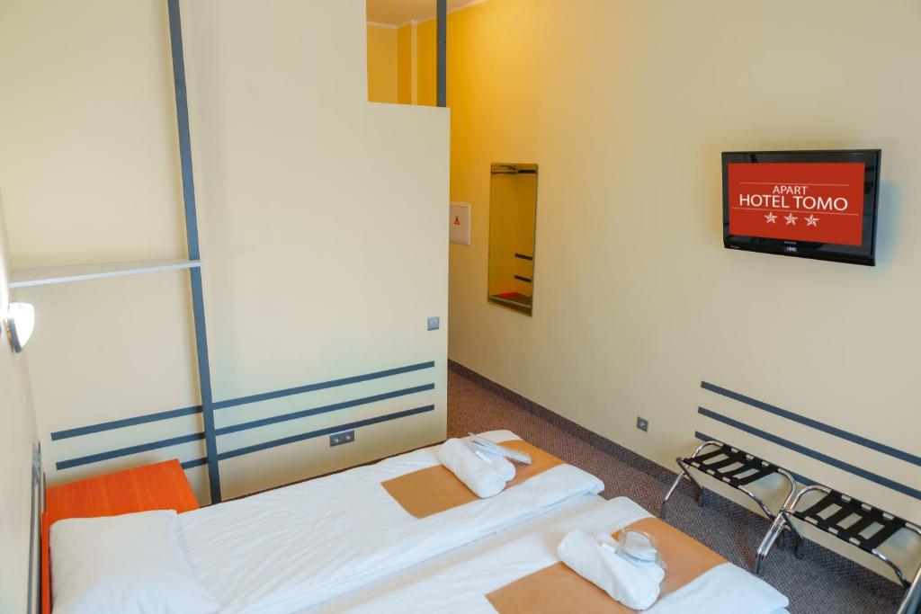 Postel nebo postele na pokoji v ubytování Apart Hotel Tomo FREE PARKING