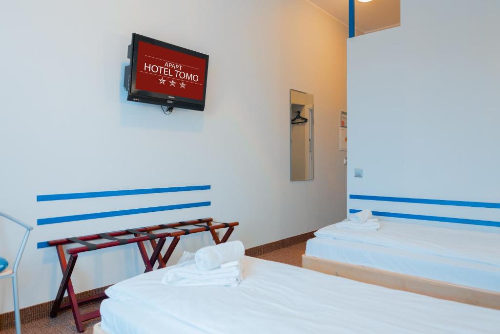 Postel nebo postele na pokoji v ubytování Apart Hotel Tomo FREE PARKING