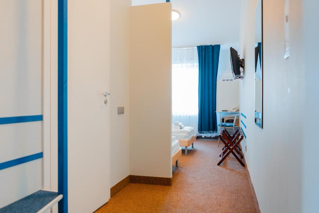 Postel nebo postele na pokoji v ubytování Apart Hotel Tomo FREE PARKING