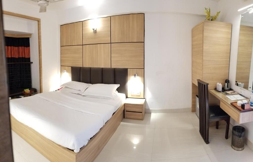 Postel nebo postele na pokoji v ubytování Roland Hotel