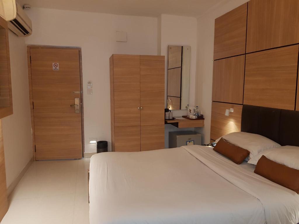 Postel nebo postele na pokoji v ubytování Roland Hotel