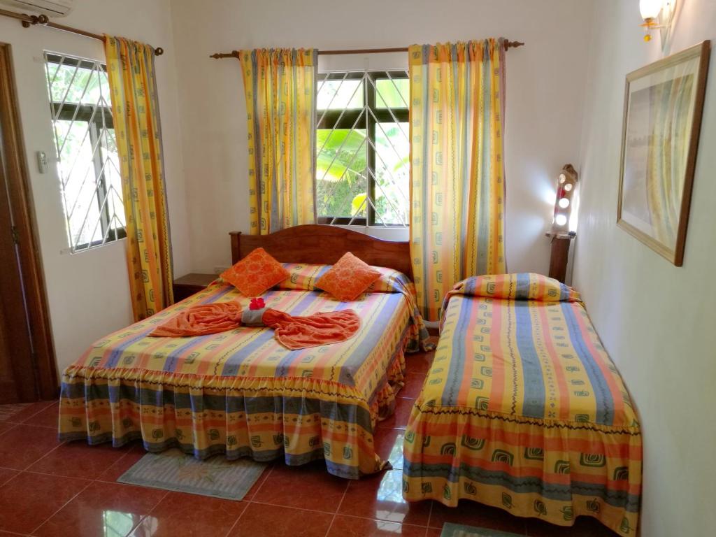 Postel nebo postele na pokoji v ubytování Coco Bay Villa