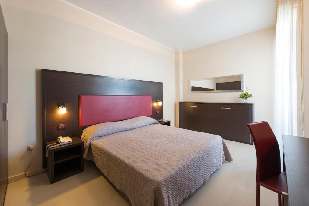 Postel nebo postele na pokoji v ubytování Grand Hotel Adriatico