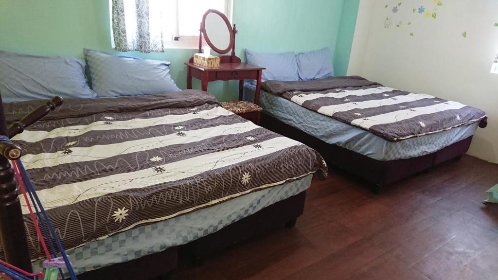 Postel nebo postele na pokoji v ubytování Haven Seaview Homestay