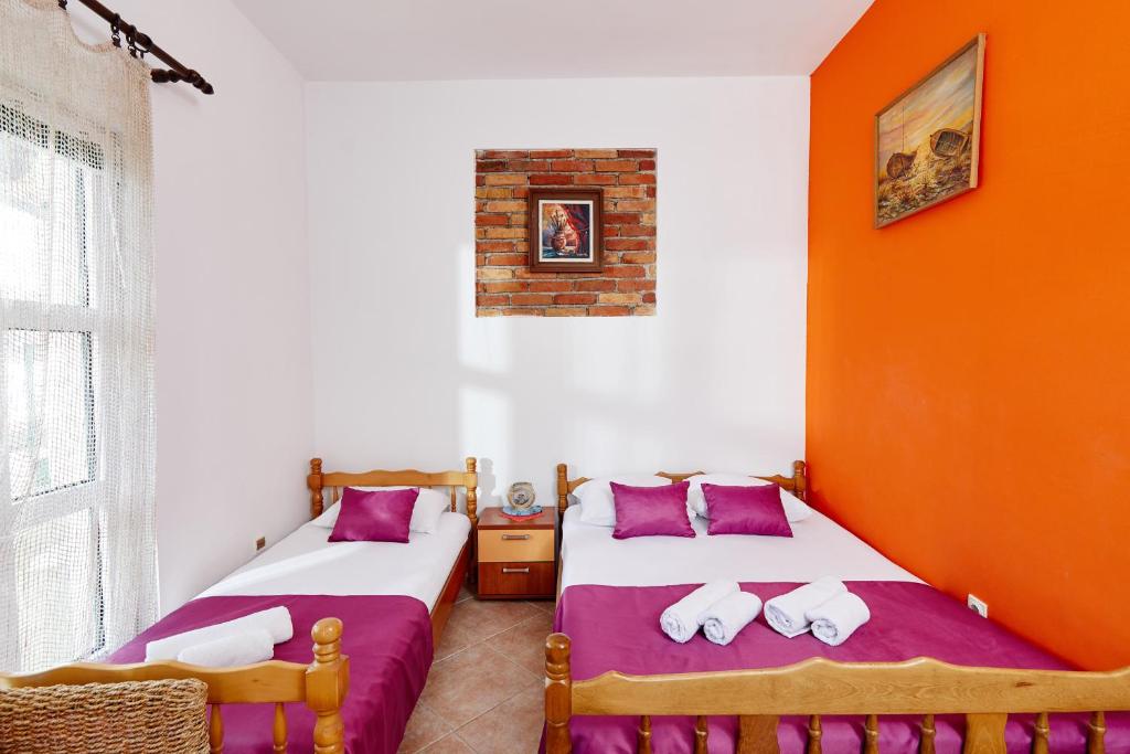 Postel nebo postele na pokoji v ubytování Rosic Apartments Baosici