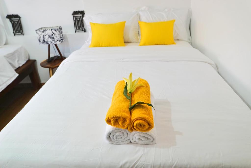 Postel nebo postele na pokoji v ubytování ANGKOR DINO B&B