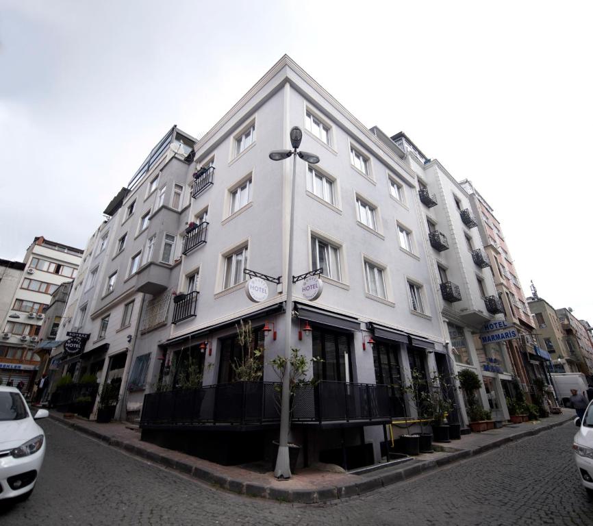 a white building on the side of a street at BGuest Hotel & Residence in Istanbul