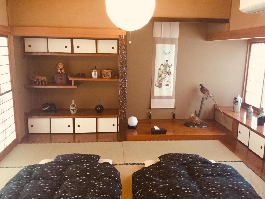 Postel nebo postele na pokoji v ubytování 島の宿 近 〜KON〜