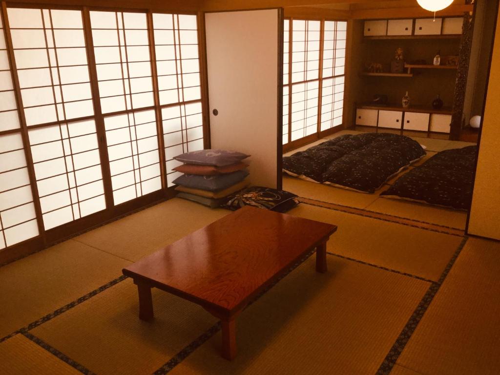 Postel nebo postele na pokoji v ubytování 島の宿 近 〜KON〜