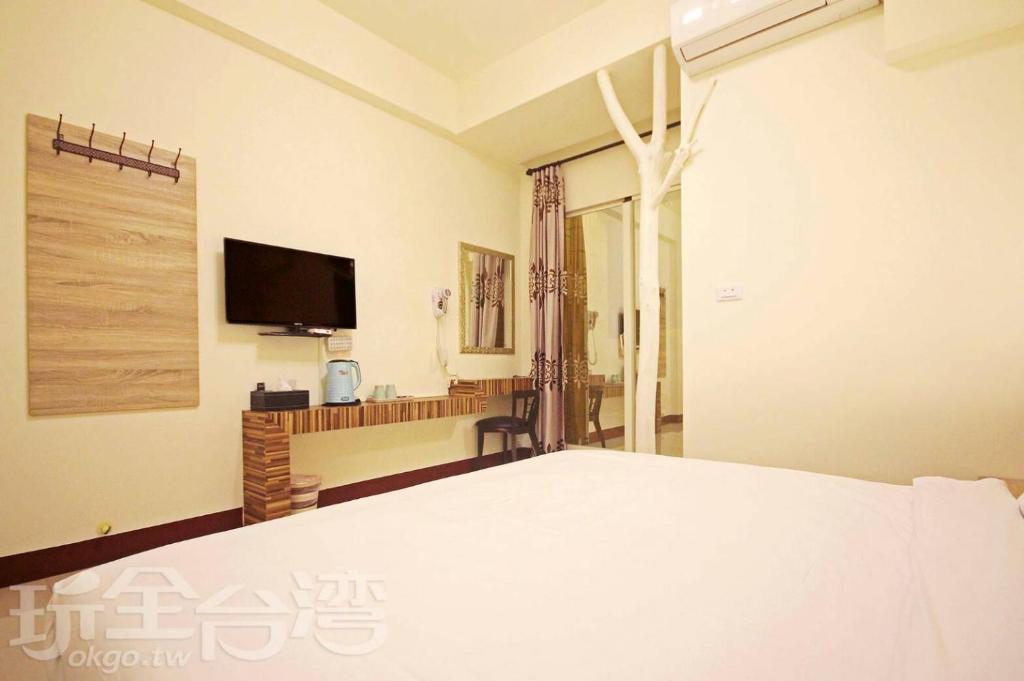 TV o dispositivi per l'intrattenimento presso Plum Green Homestay
