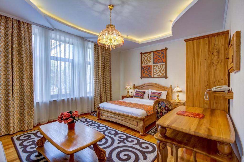 Postel nebo postele na pokoji v ubytování Navat Hotel