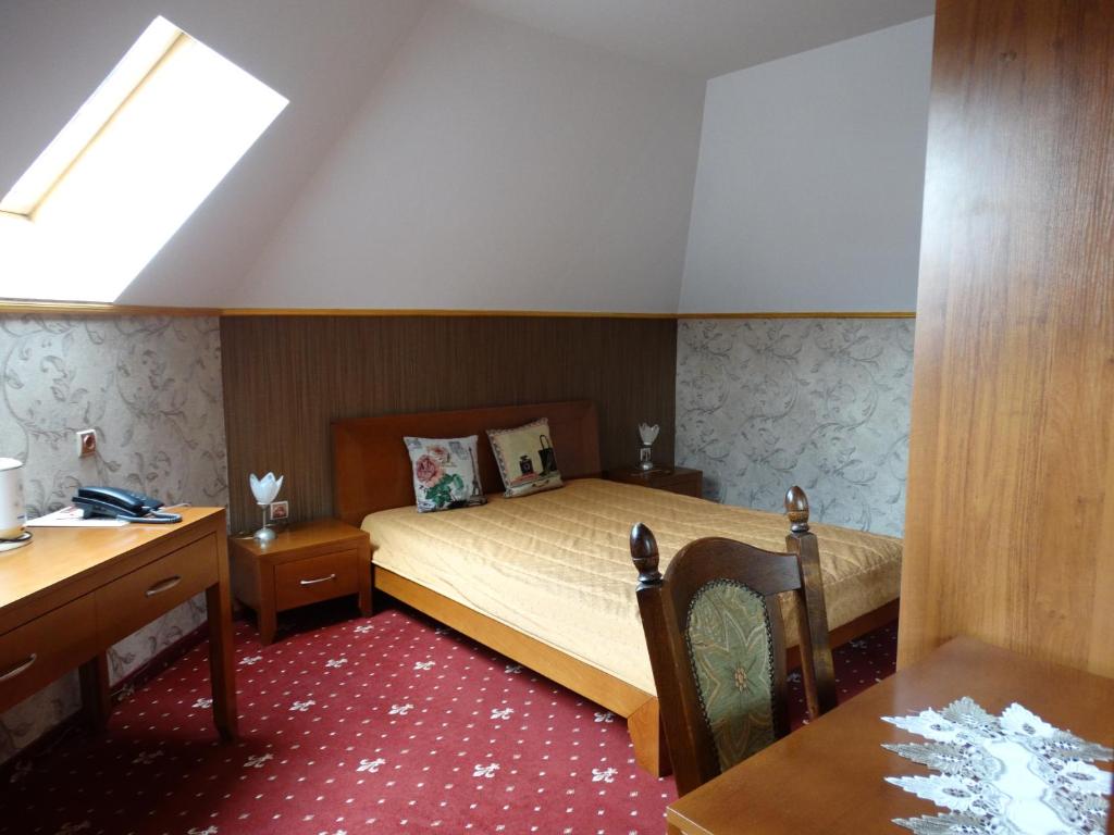 Кровать или кровати в номере Vesta Hotel