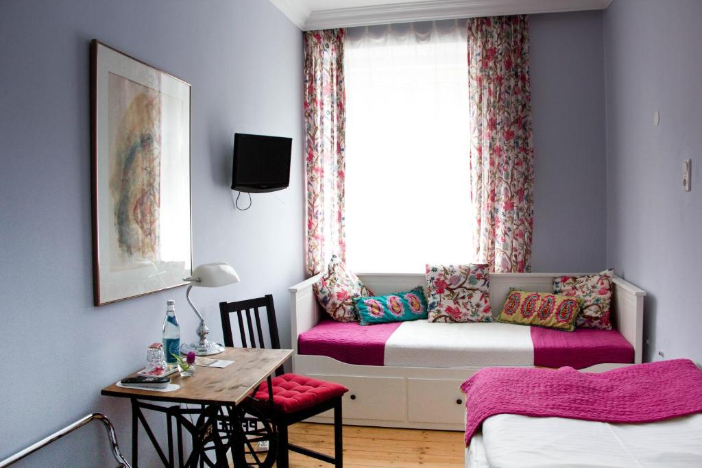 Postel nebo postele na pokoji v ubytování das HOTEL in München