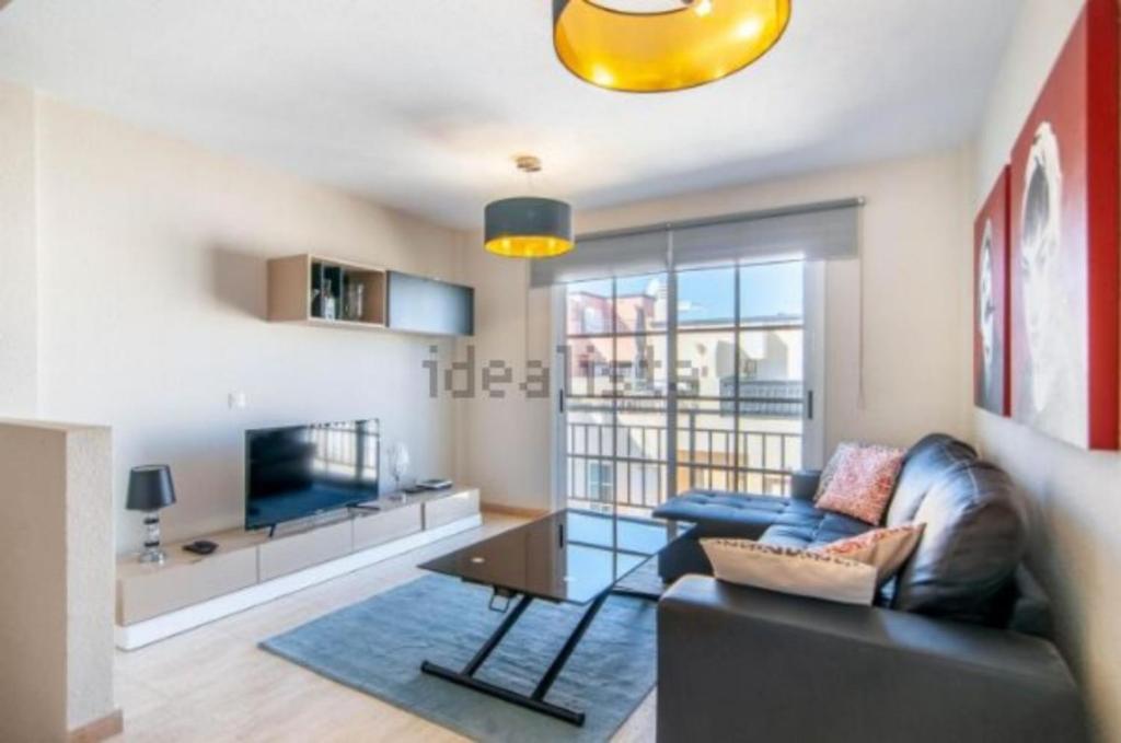 TV a/nebo společenská místnost v ubytování Two bedroom duplex with spectacular ocean view in Costa Adeje