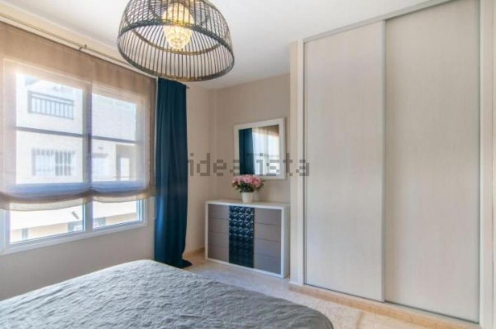 Postel nebo postele na pokoji v ubytování Two bedroom duplex with spectacular ocean view in Costa Adeje