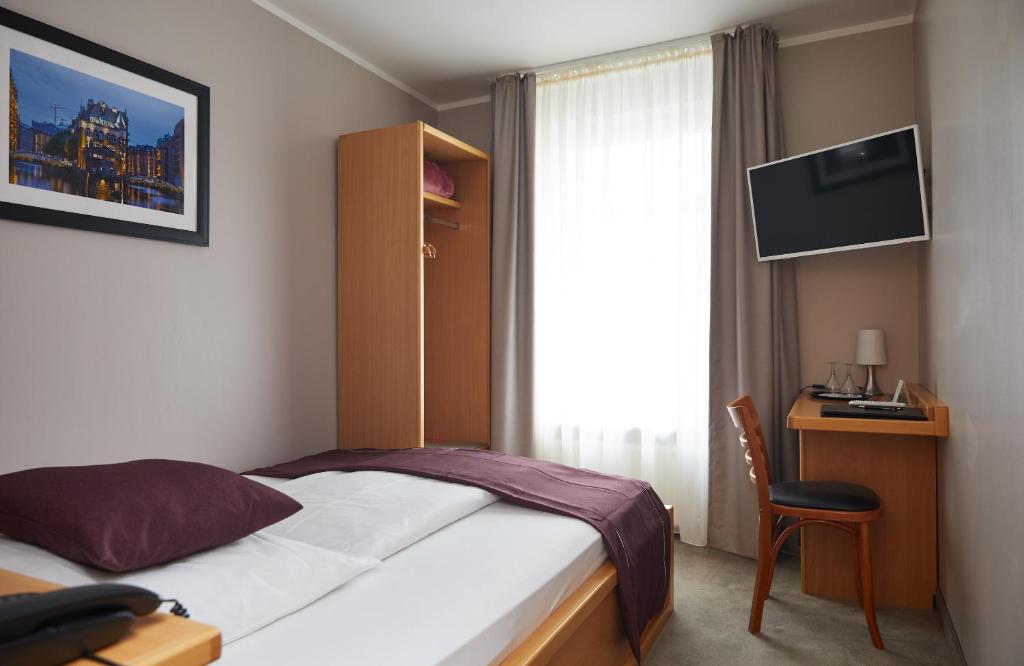 TV a/nebo společenská místnost v ubytování Hotel Hafentor
