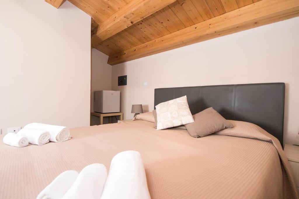 Postel nebo postele na pokoji v ubytování Casa Malaclà B&B