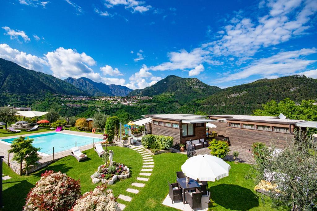 an aerial view of a resort with a pool and mountains at GeoResort in Tremosine Sul Garda